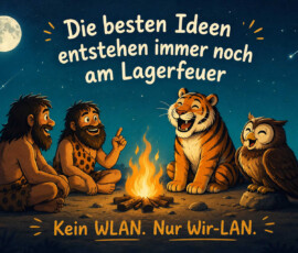 Zwei lachende Steinzeitmenschen sitzen gemeinsam mit einem Tiger und einer Eule um ein Lagerfeuer. Über ihnen leuchten ein Vollmond, zahlreiche Sterne und mehrere Sternschnuppen. Mensch und Tier scheinen einander aufmerksam zuzuhören und großen Spaß an der Unterhaltung zu haben. Der Text lautet: „Die besten Ideen entstehen immer noch am Lagerfeuer. Kein WLAN. Nur Wir-LAN.“